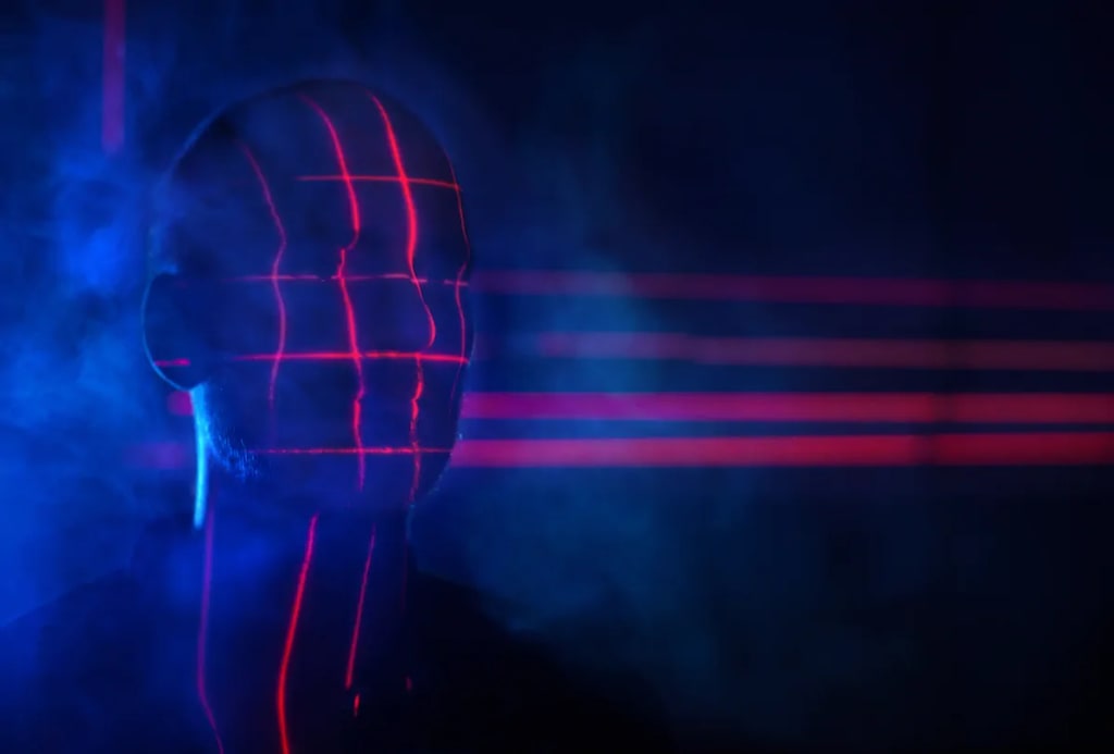 Red laser grid on man's face depicting artificial intelligence and consciousness concepts. Red laser grid on man's face depicting artificial intelligence and consciousness concepts.