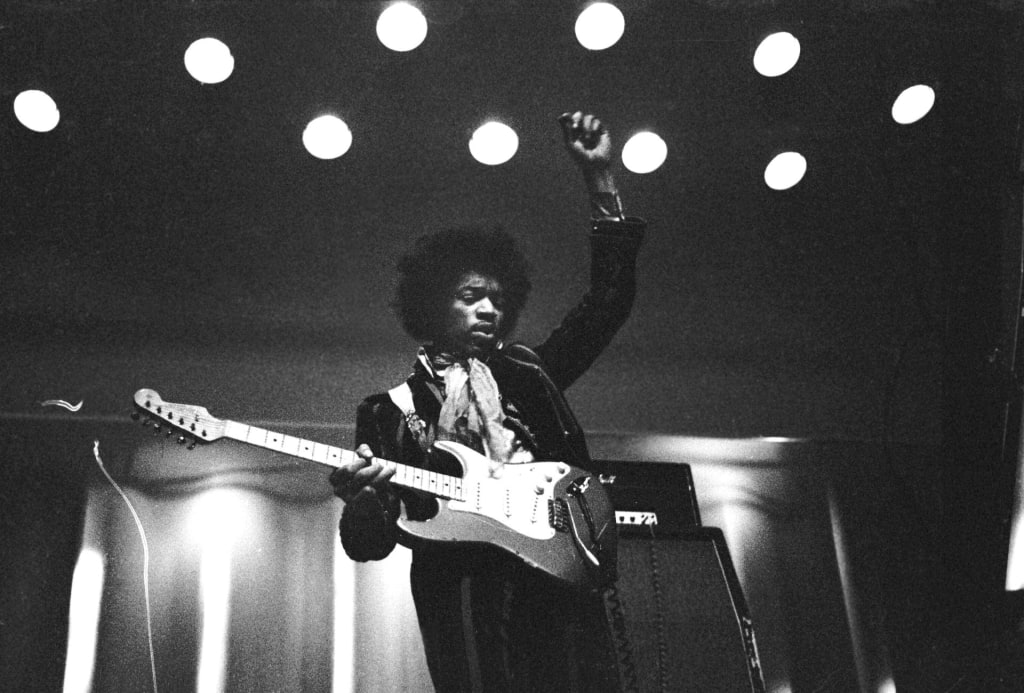Jimi Hendrix performing live on stage, exemplifying a key figure of the 27 Club in popular music. Photo by Hannu Lindroos/Lehtikuva, Public domain. Jimi Hendrix performing live on stage, exemplifying a key figure of the 27 Club in popular music. Photo by Hannu Lindroos/Lehtikuva, Public domain.