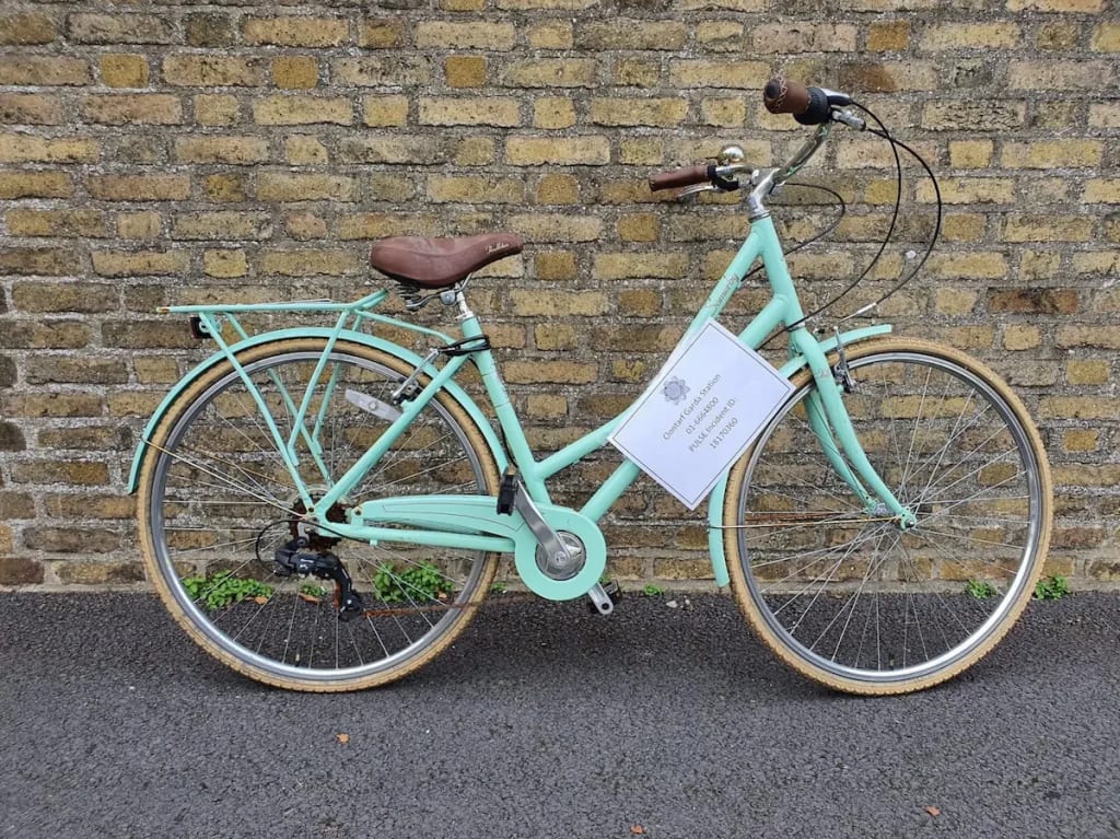 A bicycle with a Garda contact notice attached, indicating a recovered stolen bike in Dublin with police incident details. Photo by Clontarf Garda Station. A bicycle with a Garda contact notice attached, indicating a recovered stolen bike in Dublin with police incident details. Photo by Clontarf Garda Station.