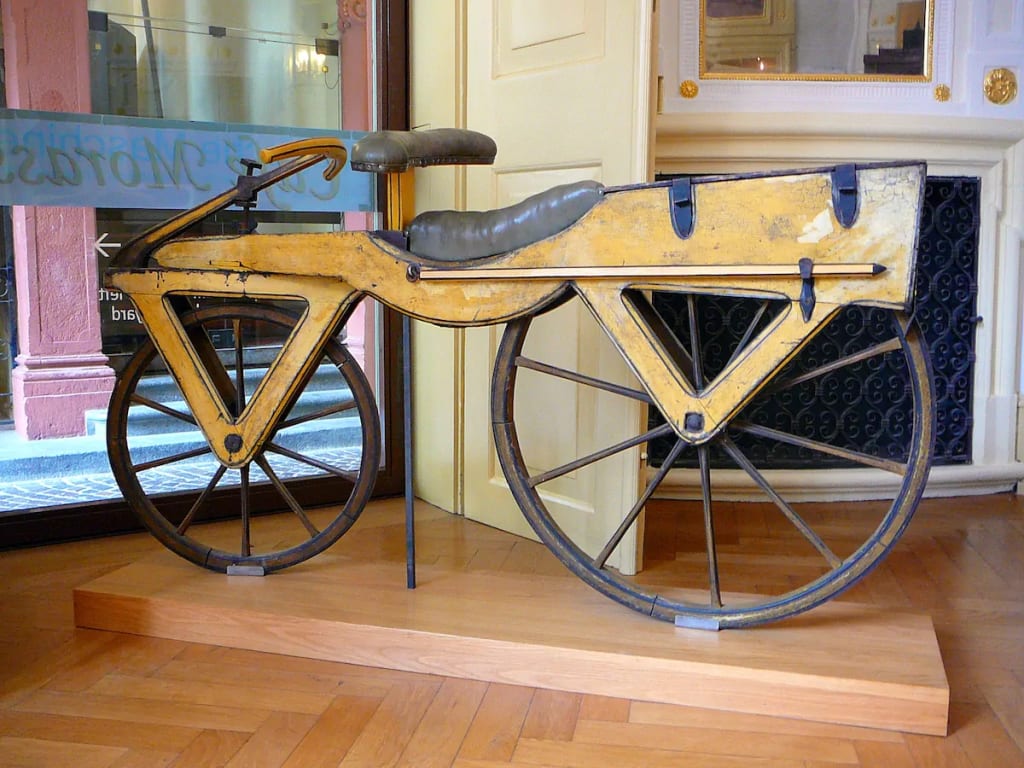 The wooden draisine, the precursor to the modern bicycle, invented in 1817. Displayed at the Kurpfälzisches Museum in Heidelberg, Germany. Photo by Gun Powder Ma. The wooden draisine, the precursor to the modern bicycle, invented in 1817. Displayed at the Kurpfälzisches Museum in Heidelberg, Germany. Photo by Gun Powder Ma.
