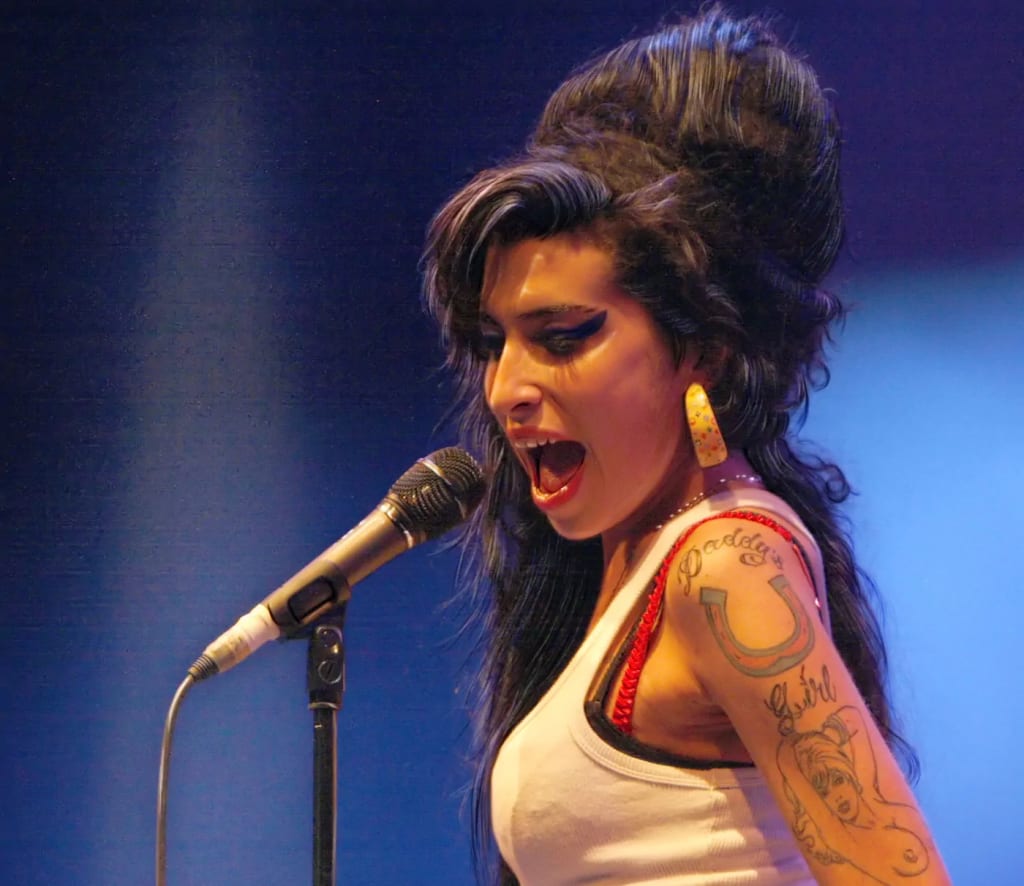 Amy Winehouse biography: The complete story of Britain's most iconic soul singer. Photo by Rama. Amy Winehouse biography: The complete story of Britain's most iconic soul singer. Photo by Rama.