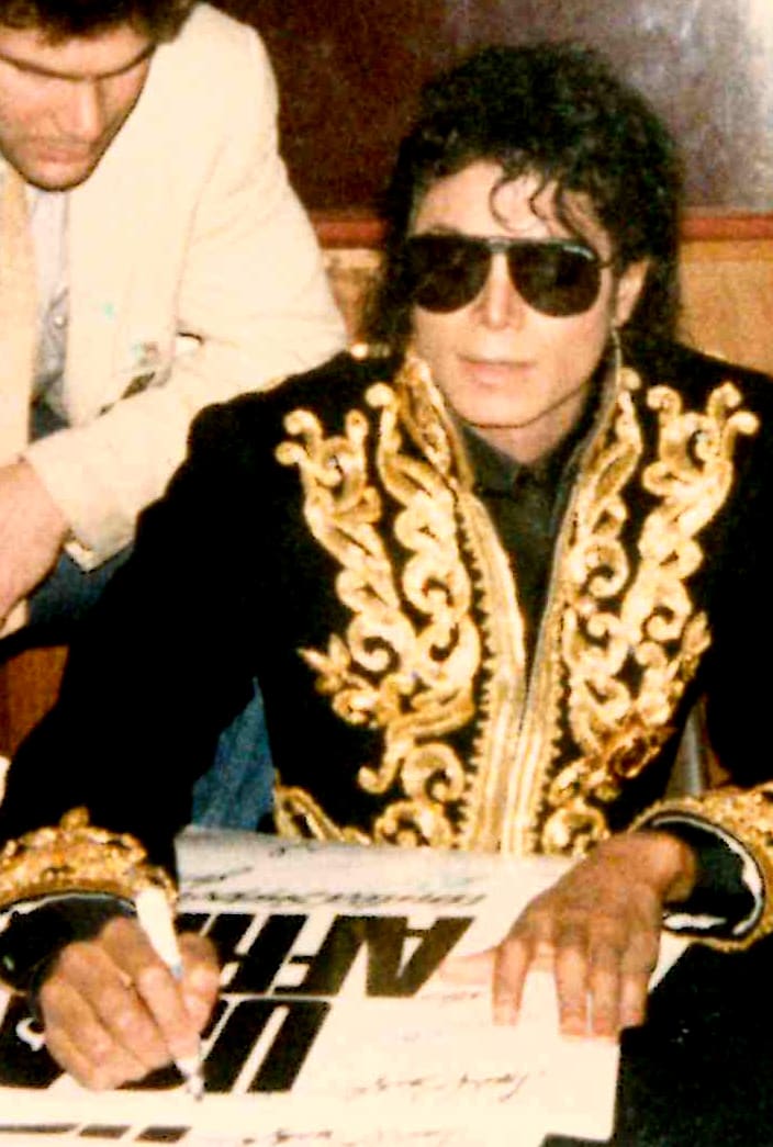 Jackson signing a "We Are the World" poster in 1985. Photo by Glenn Francis. Jackson signing a "We Are the World" poster in 1985. Photo by Glenn Francis.