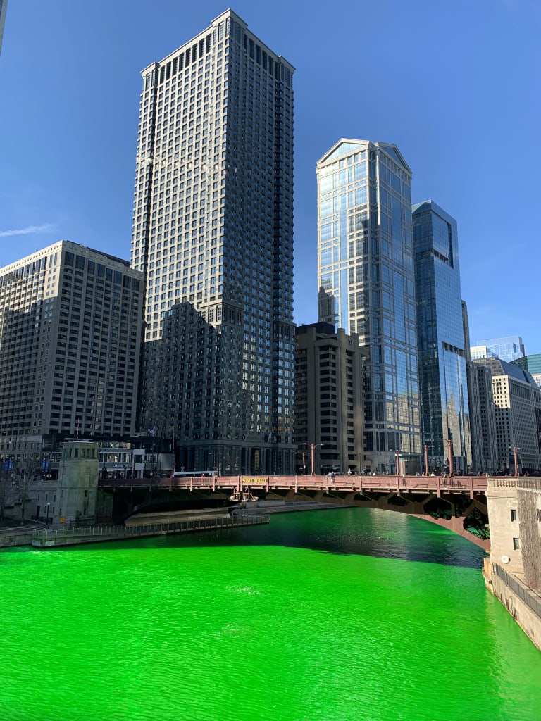 The Chicago River dyed green for Saint Patrick's Day. Photo by Rento Maalari. The Chicago River dyed green for Saint Patrick's Day. Photo by Rento Maalari.