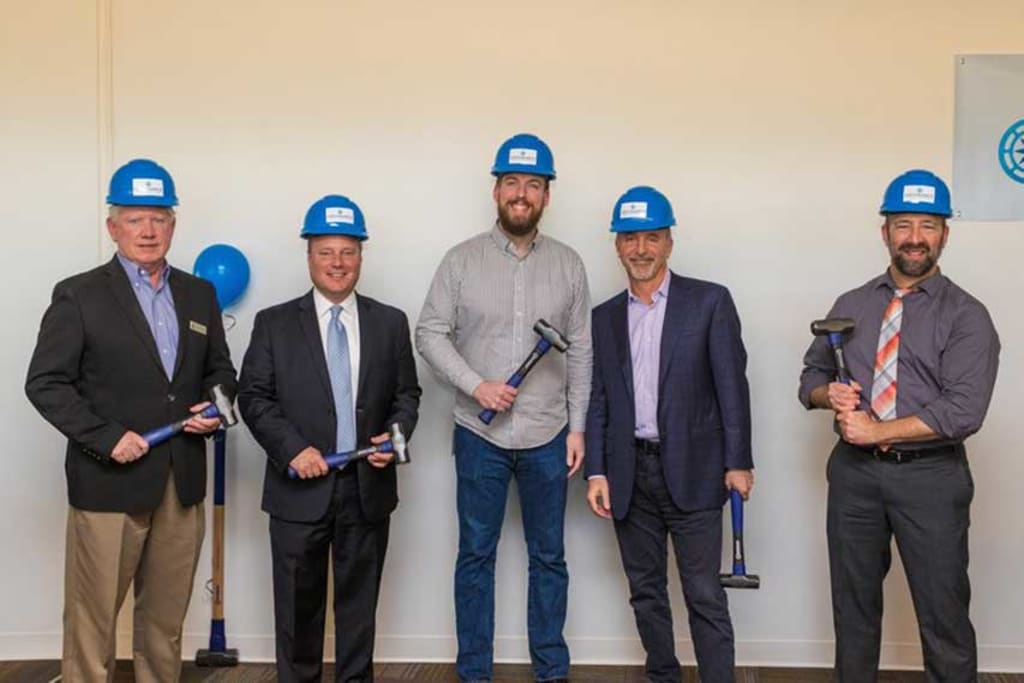 Arizona Commerce Authority's Kevin Sullivan, Tempe Mayor Mark Mitchell, Endurance Tempe Operations General Manager Andrew Wright, Endurance President & COO Ron LaSalvia and Scales Technology Academy Principal Stephen Wolf present at the groundbreaking at EIG's Tempe office location.