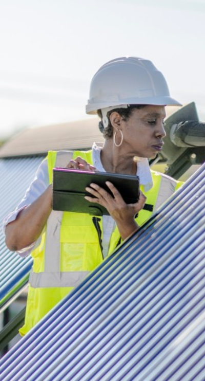 A woman installing solar panels