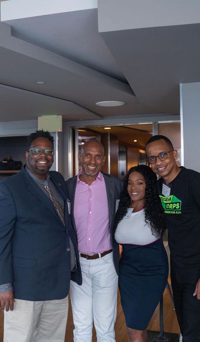 The Green For All business council members posing for a photo next to the Dream.Org logo.