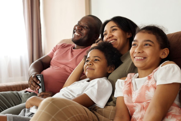 Image of family at home watching TV