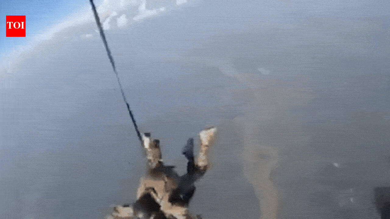 Watch: Paratrooper makes unique tandem jump with combat canine, handler