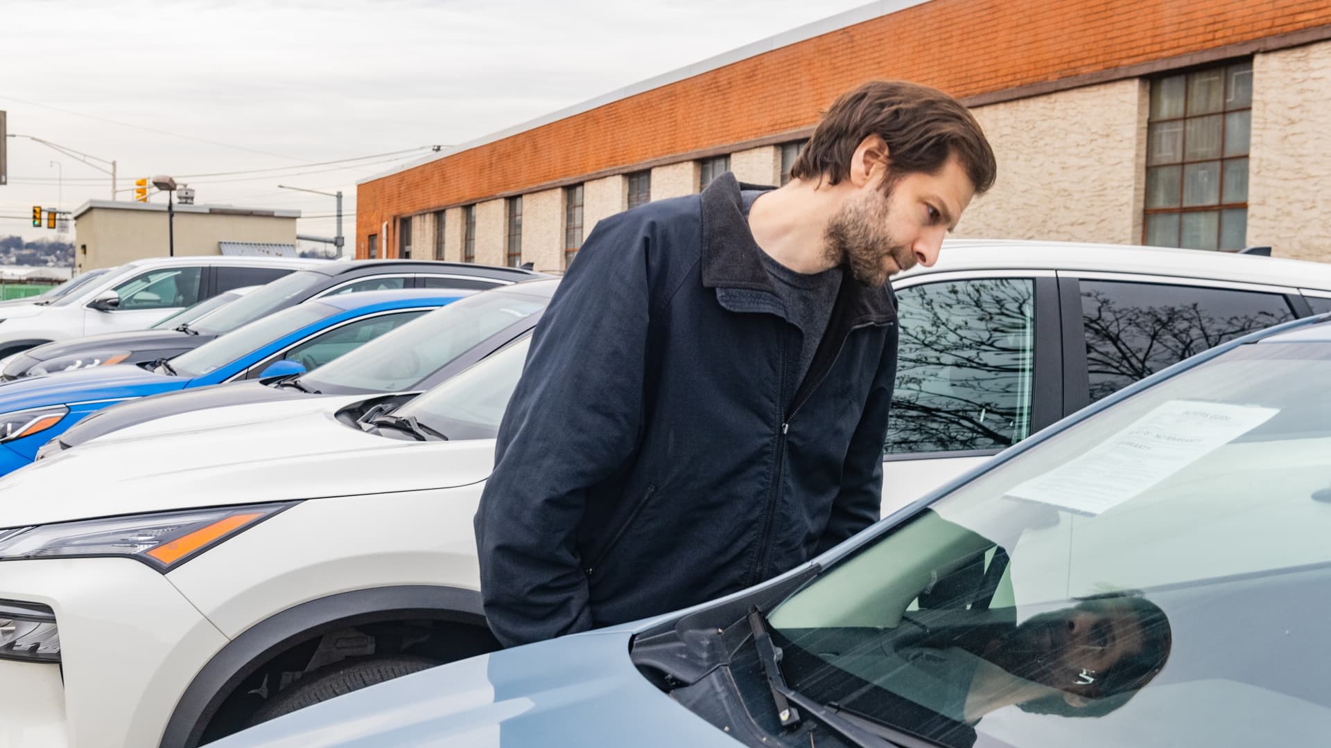 Car buyers are stretching loans to afford payments — it's a 'potential warning light,' analyst says