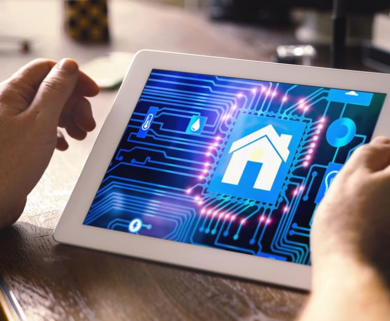 Man using a tablet to power smart devices