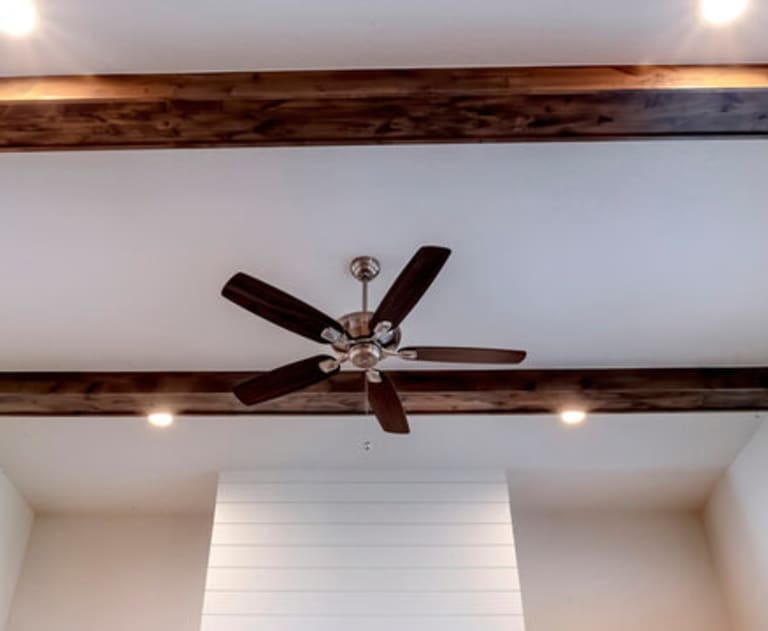 Ceiling fan and exposed beam installed by electrician near me 
