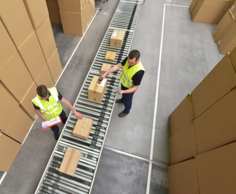 warehouse conveyor systems powered by the work of an electrician near me