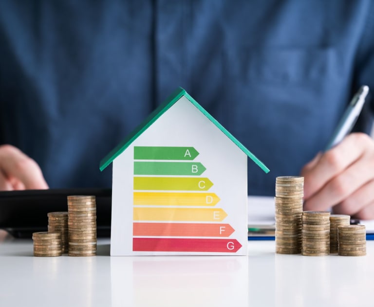 Person with house and money savings from energy audit