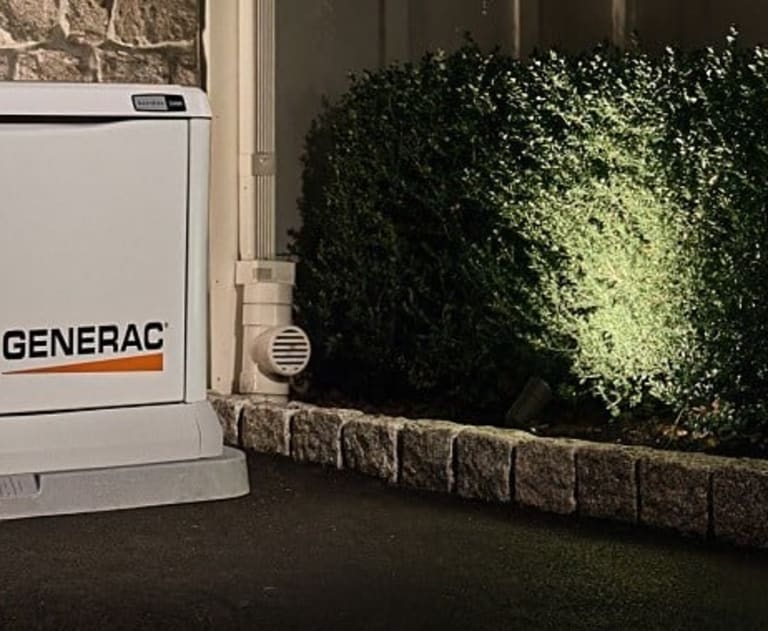 Generac generator outside a house