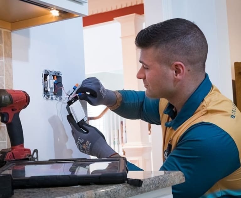 Electrician replacing or repairing wiring