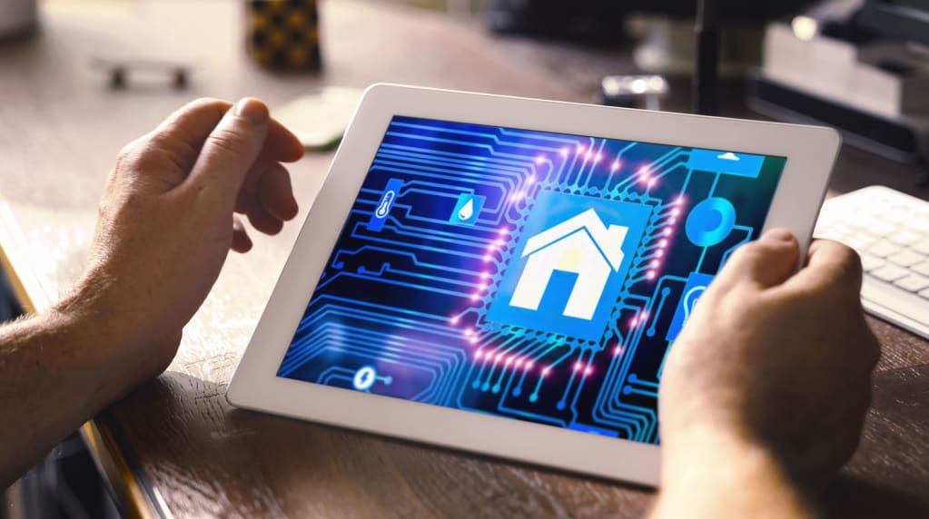 Man using a tablet to power smart devices