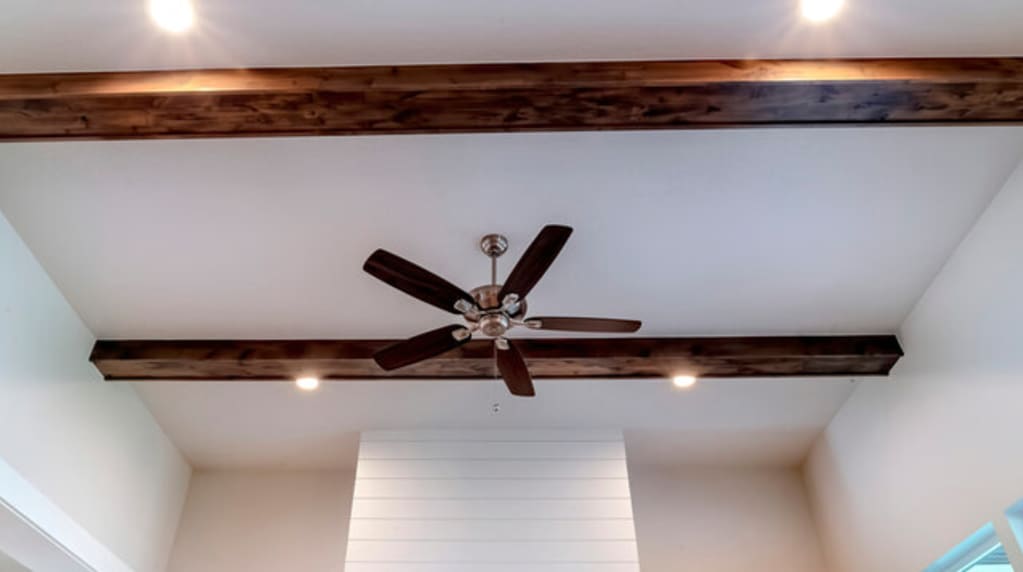 Ceiling fan and exposed beam installed by electrician near me 