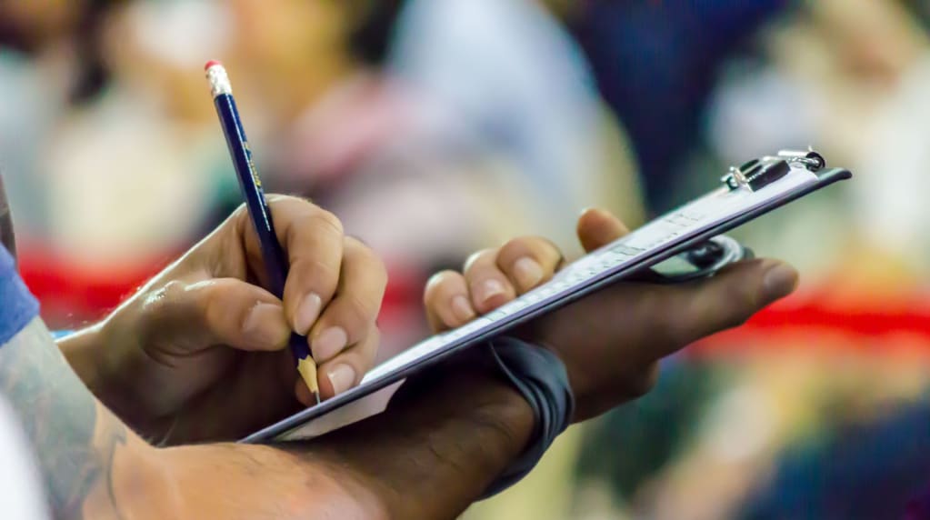 Person with an electrical fire safety checklist on a clipboard