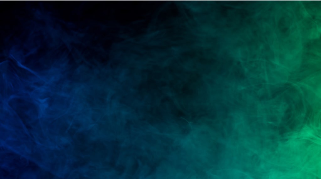 Smoke highlighted against a blue and green background