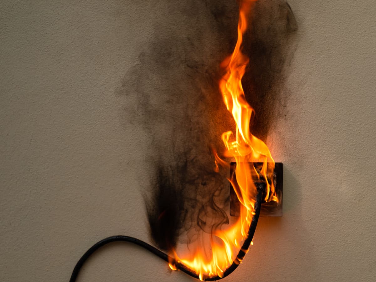 Outlet with smoke and fire