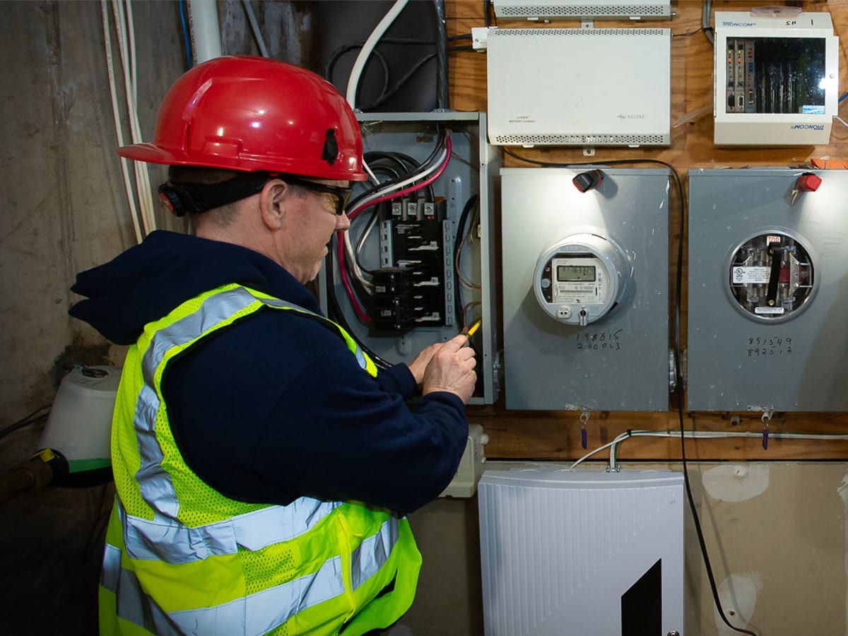 Two electricians conducting an inspection