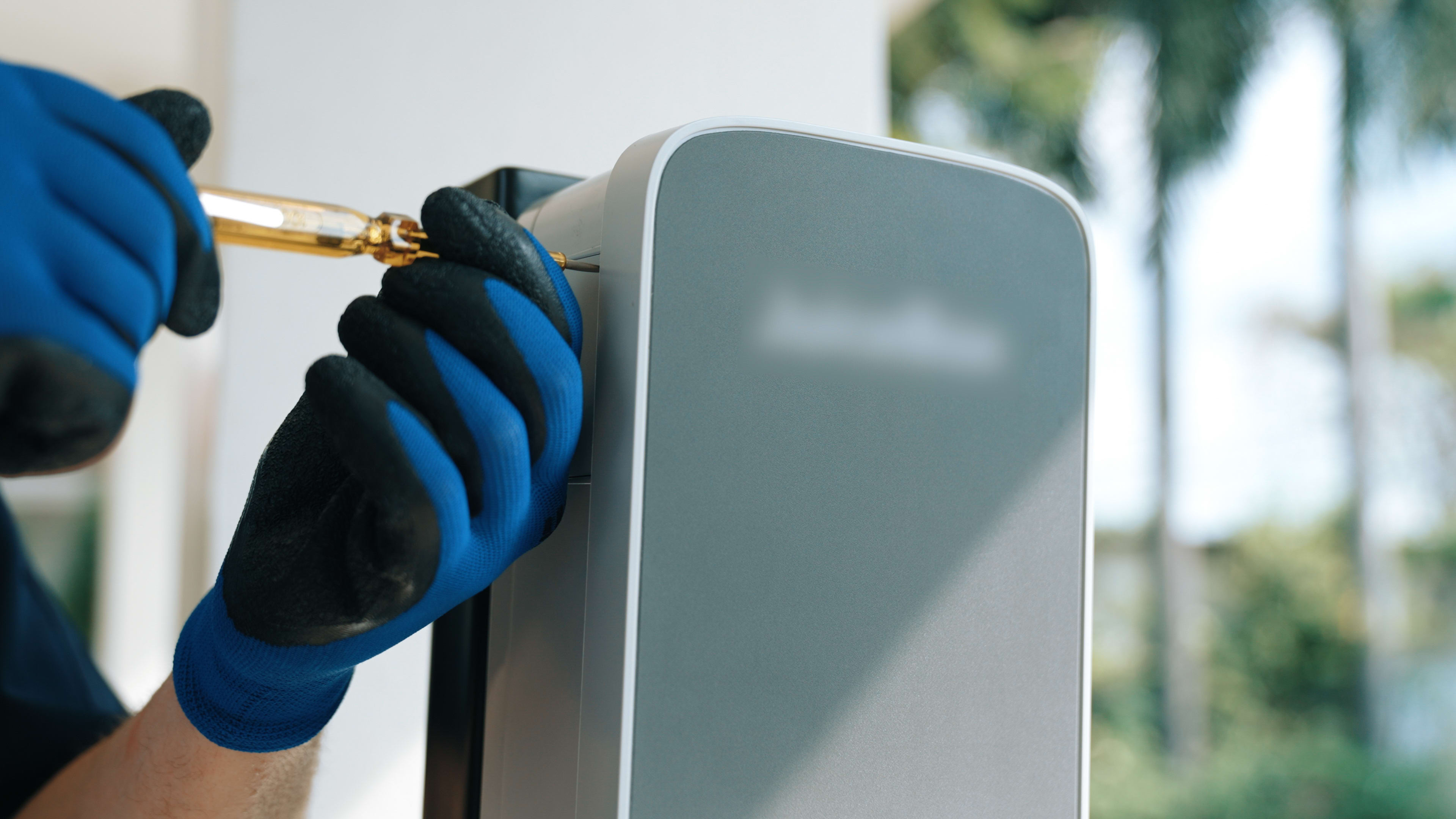 Person fixing EV charger