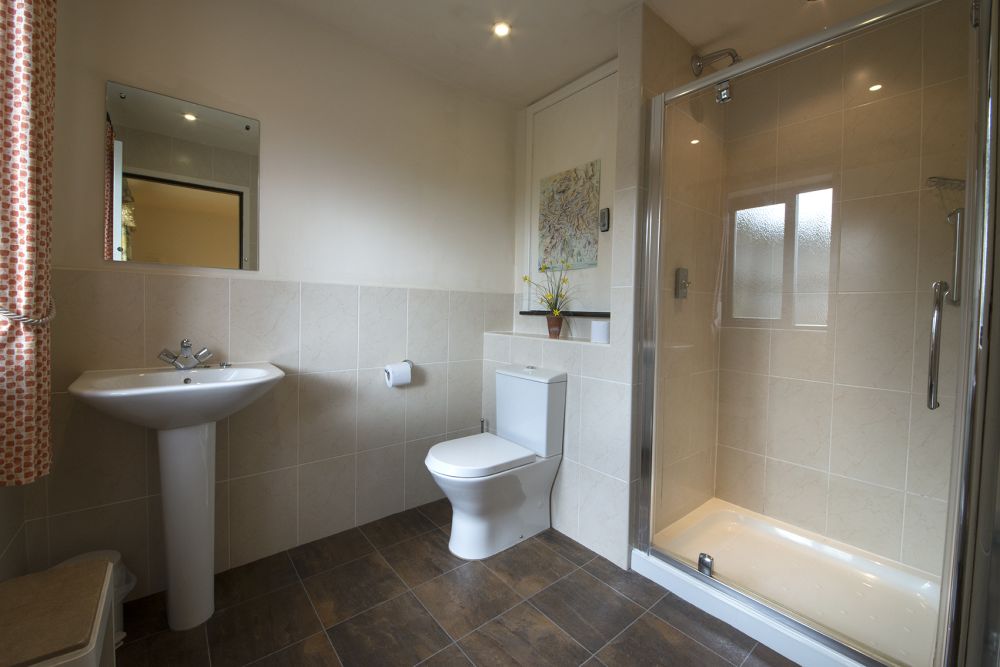 Photo of a bathroom with a walk-in shower