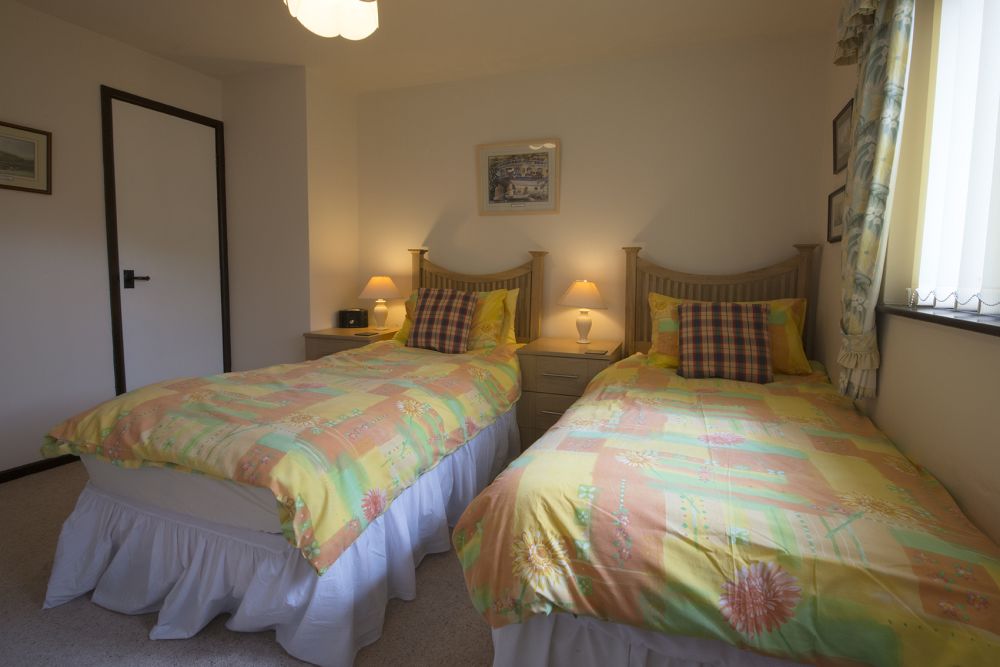 Photo of a bedroom with two twin beds