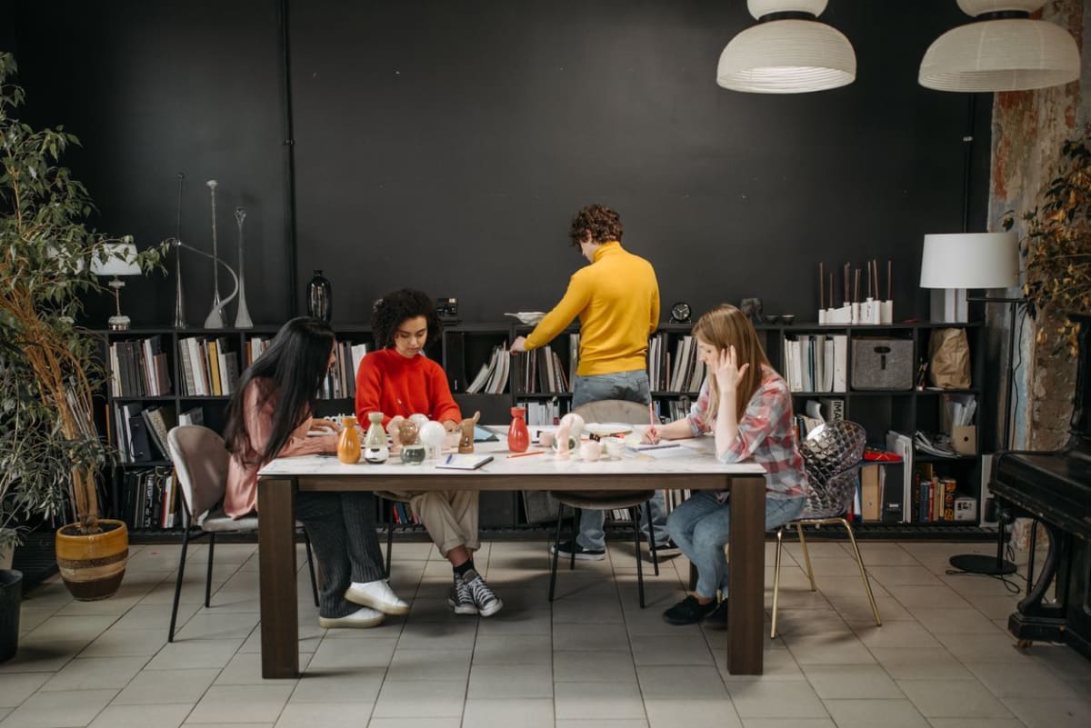 A small group in discussion around a table