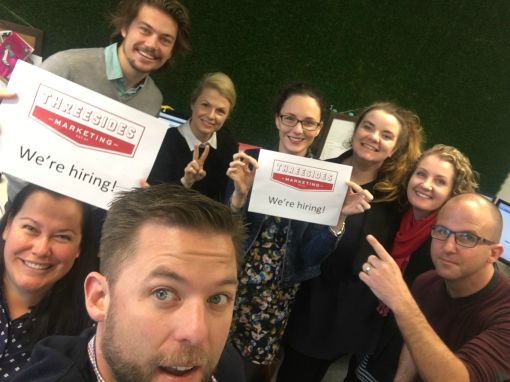 Threesides Team in front of grass for employment