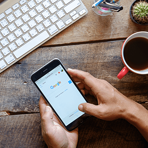 A blogger on their iPhone searching Google