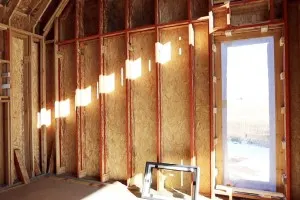 A Passive House with Double Stud Walls and Bark Siding 