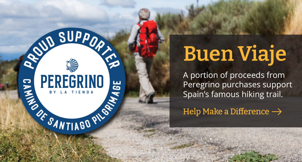 Sliced Jamon in a plate with some olives and a knife out of focus