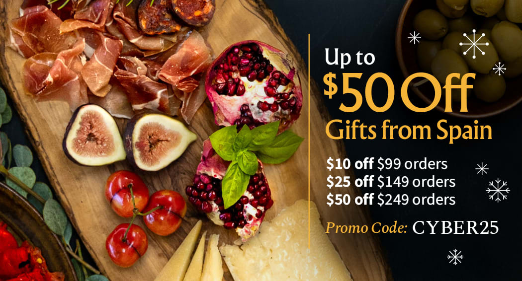 Sliced Jamon in a plate with some olives and a knife out of focus