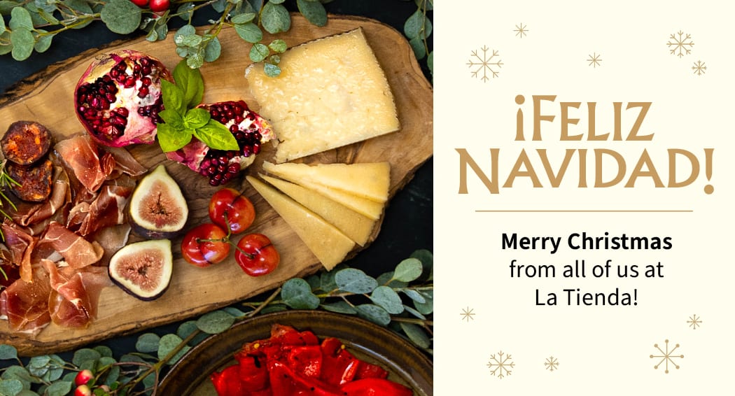 Sliced Jamon in a plate with some olives and a knife out of focus