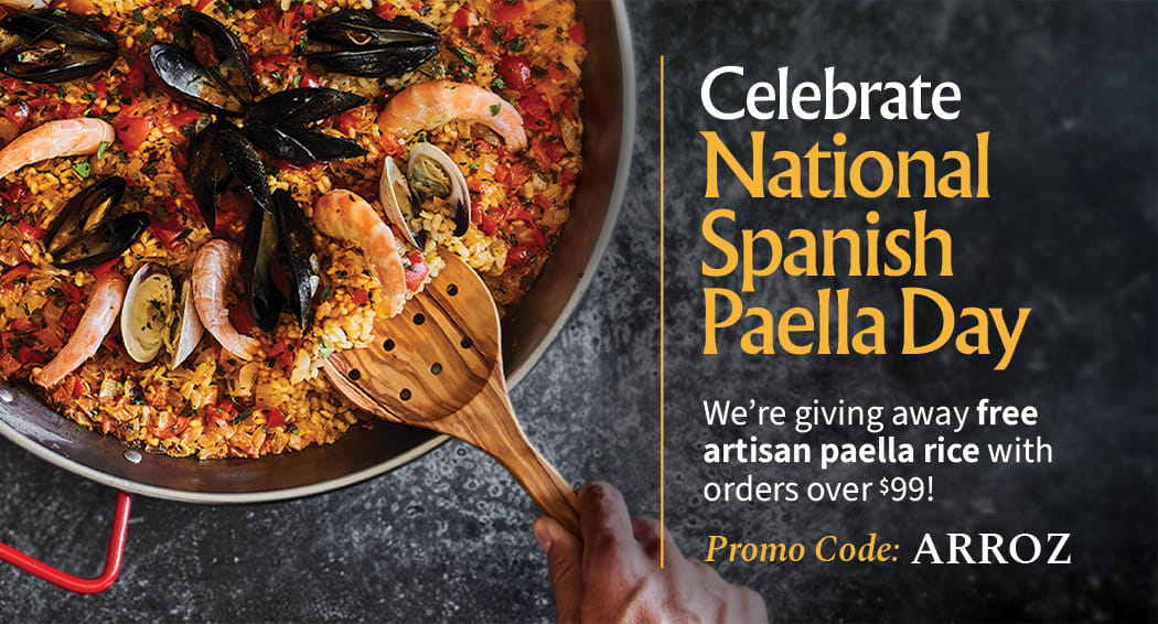 Sliced Jamon in a plate with some olives and a knife out of focus