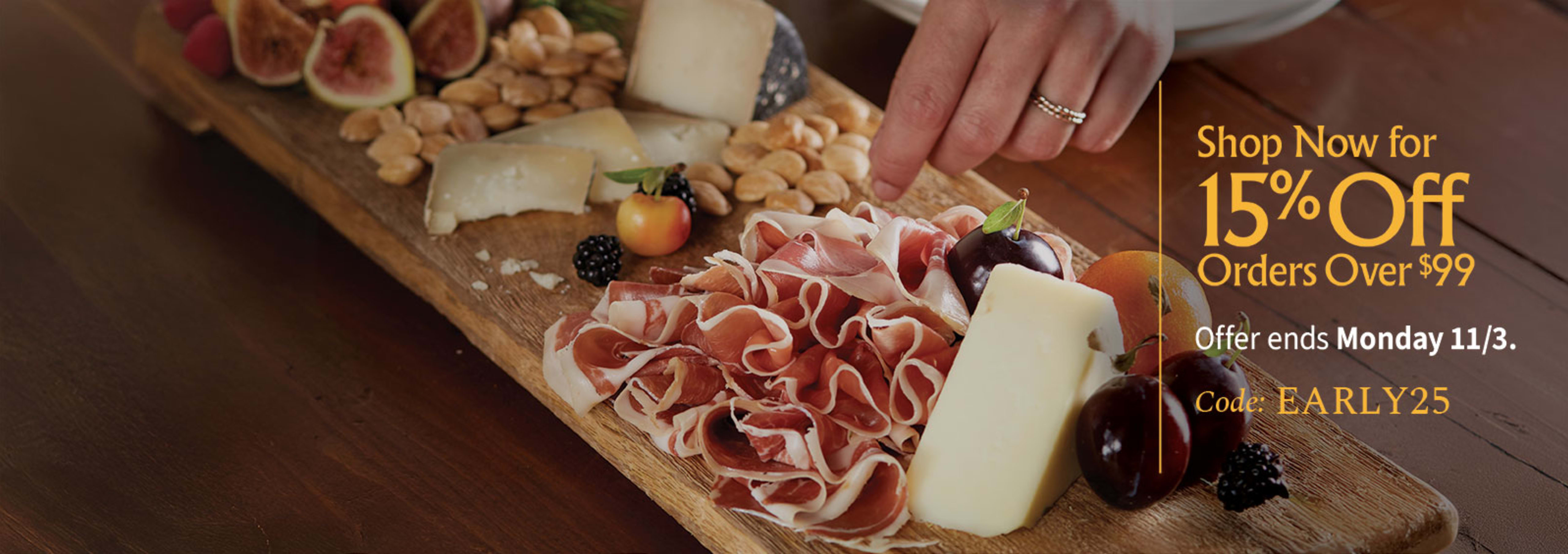 Sliced Jamon in a plate with some olives and a knife out of focus