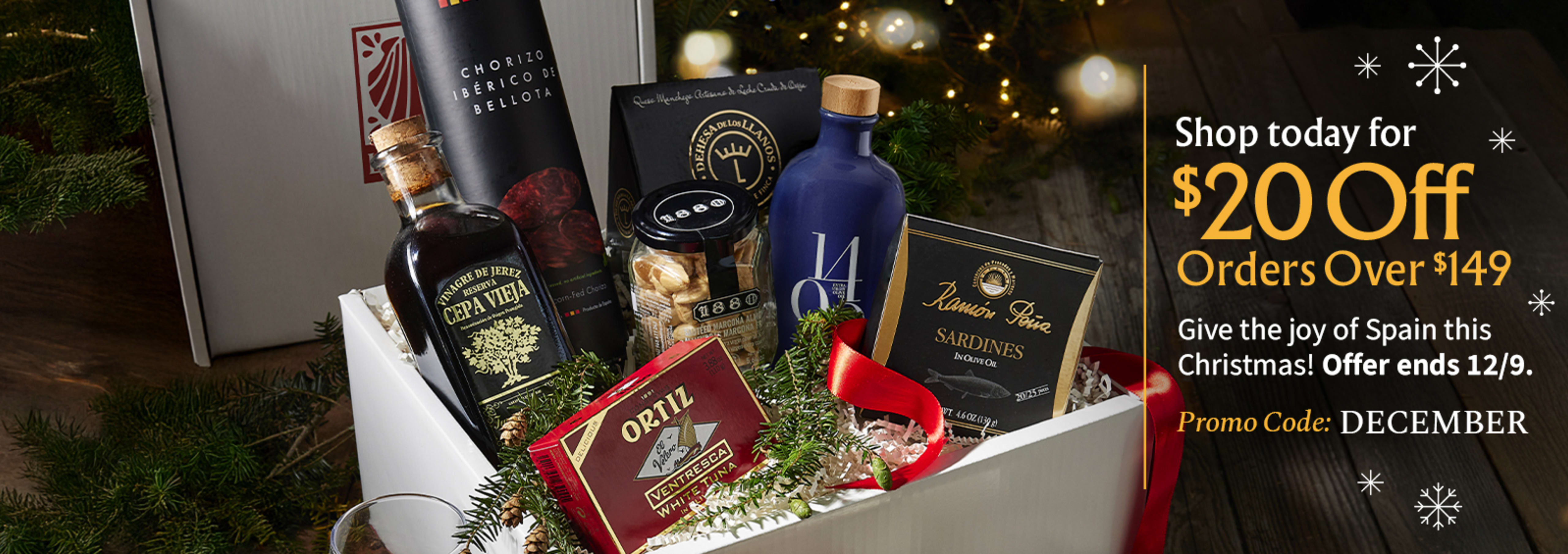 Sliced Jamon in a plate with some olives and a knife out of focus