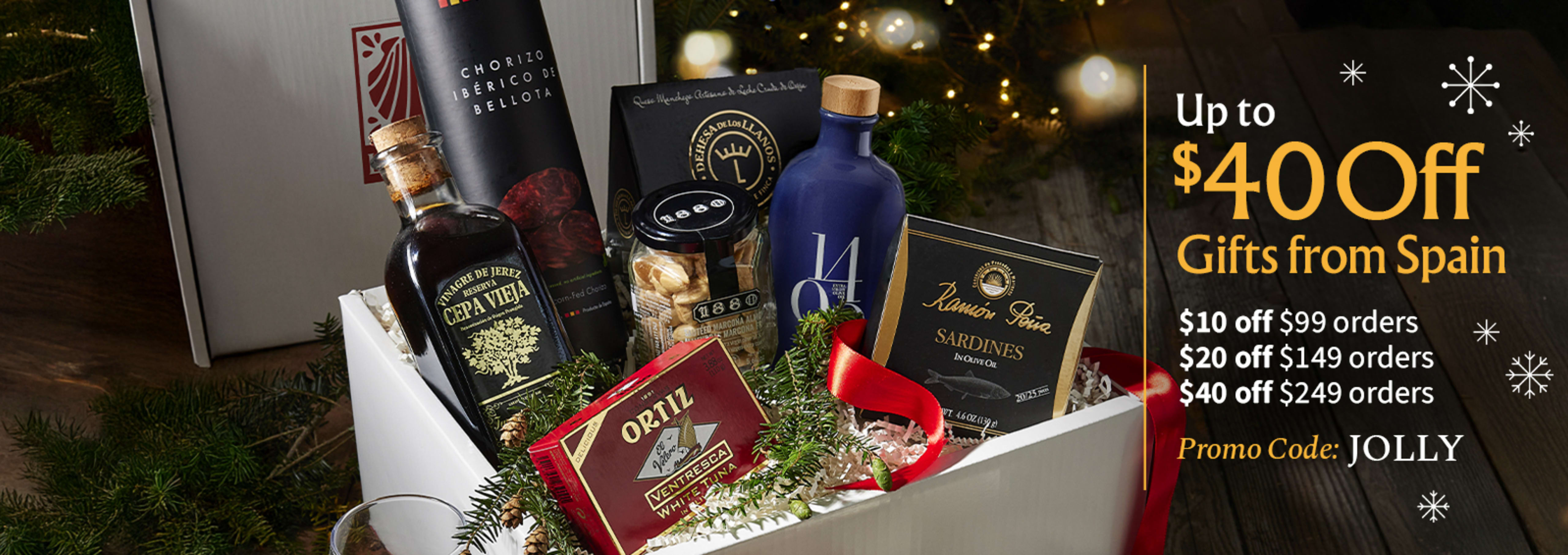 Sliced Jamon in a plate with some olives and a knife out of focus