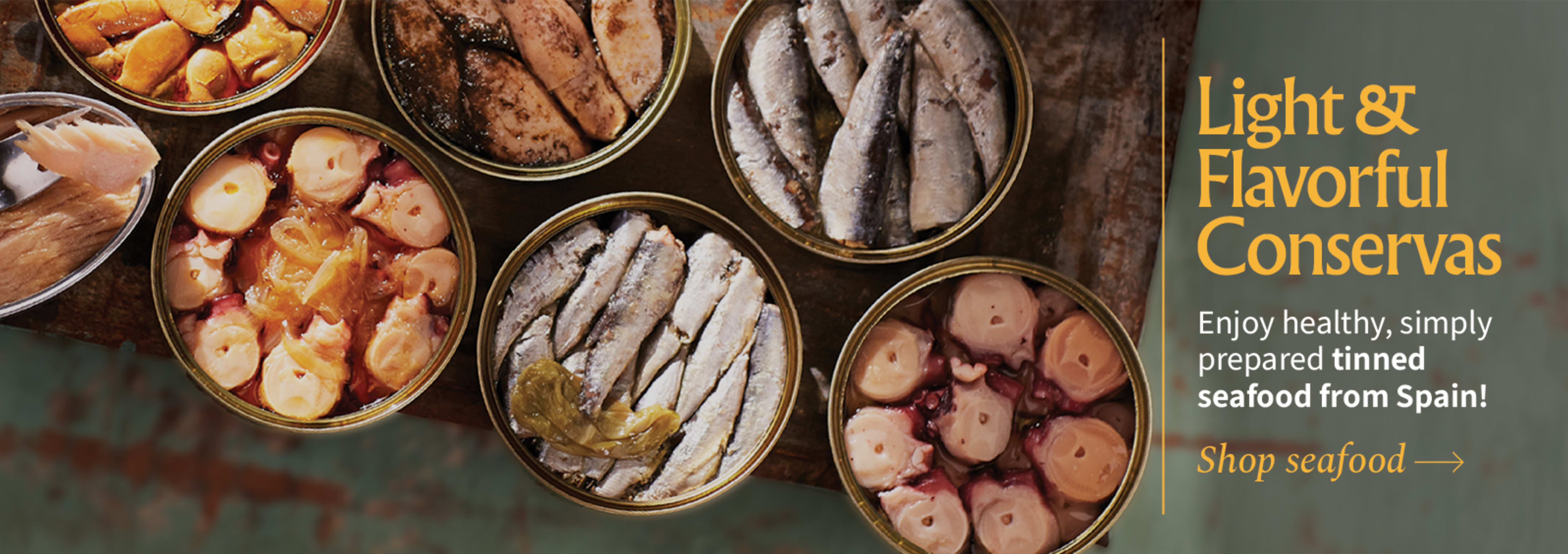 Sliced Jamon in a plate with some olives and a knife out of focus