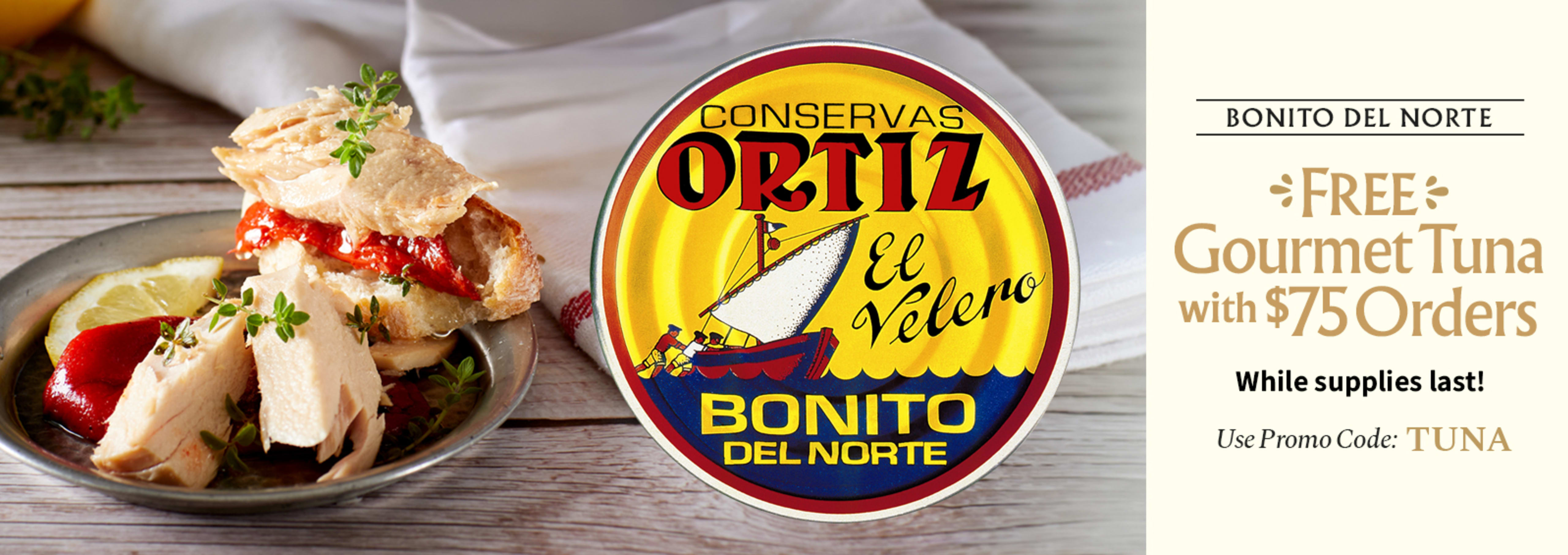 Sliced Jamon in a plate with some olives and a knife out of focus