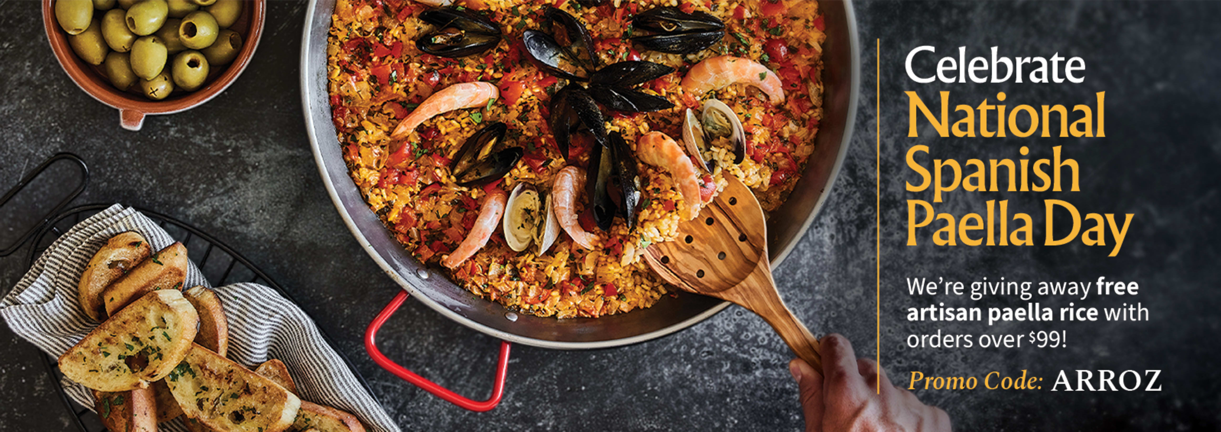 Sliced Jamon in a plate with some olives and a knife out of focus