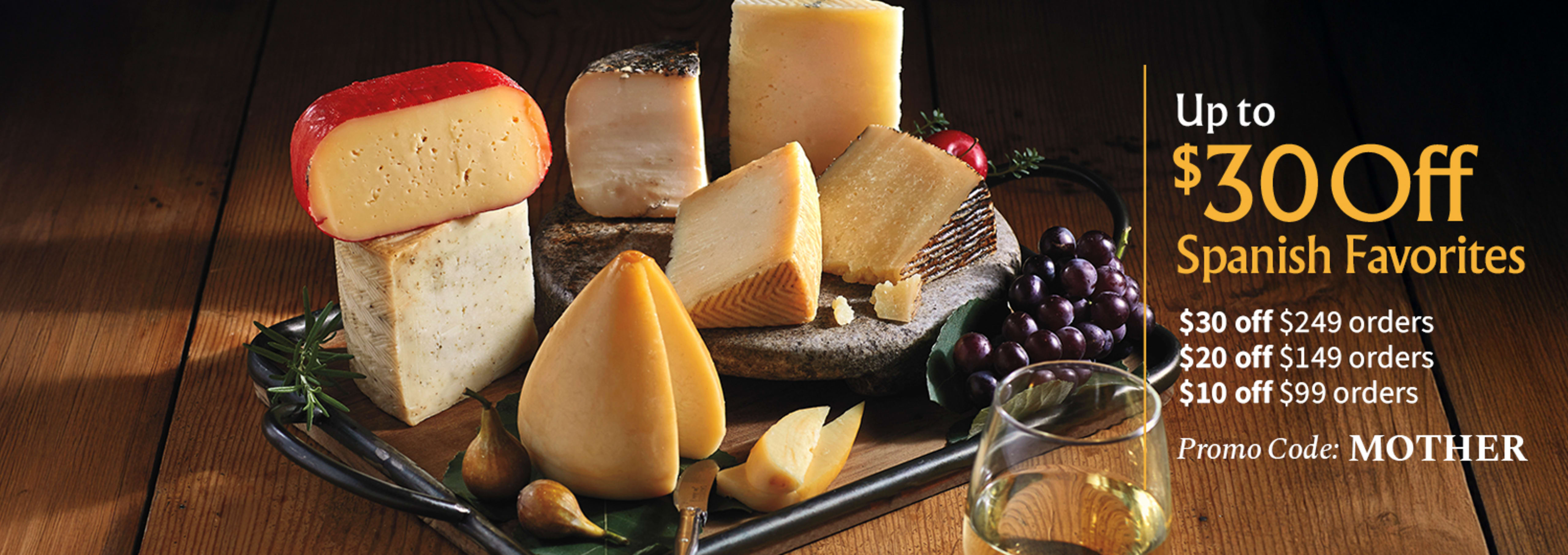 Sliced Jamon in a plate with some olives and a knife out of focus