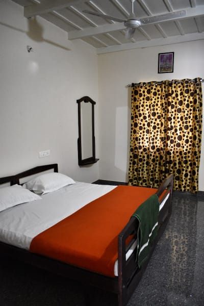 Another spacious bedroom at our villa, designed for comfort and relaxation during your Coorg trip