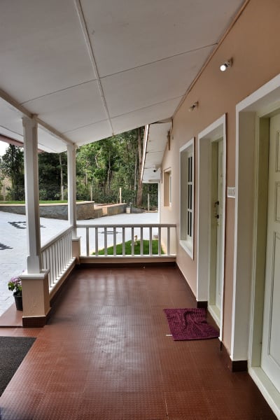 Beautifully designed sit-out area with a view of the surrounding greenery at our Coorg homestay