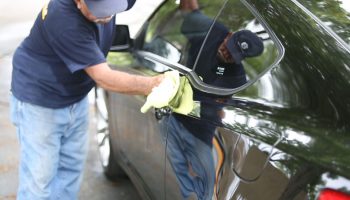 Staff cleaning car