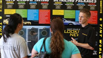 Customers looking at display board