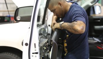 Man installing window tint
