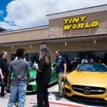 Yellow Benz with People In Front of It