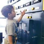 Child Adjusting Stereo Equipment